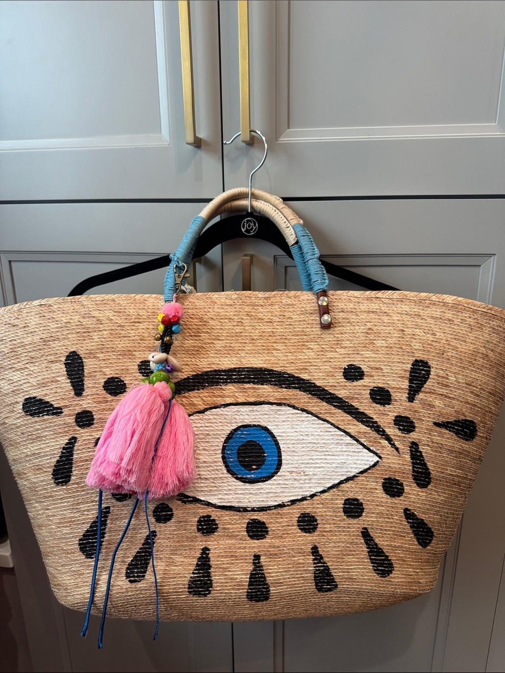 Straw Eye Tote Bag with Pink Tassel Accent